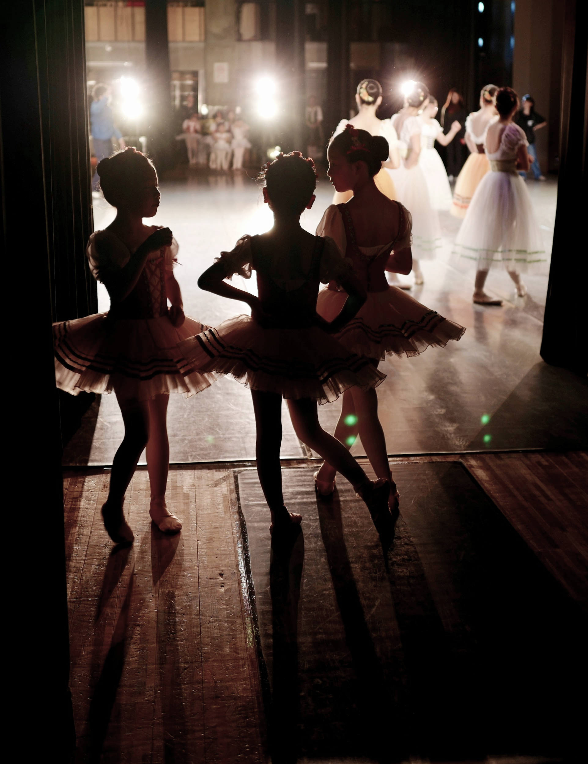 Three ballet dancers off stage